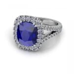 White gold sapphire ring with a halo of diamonds and a split band - danae